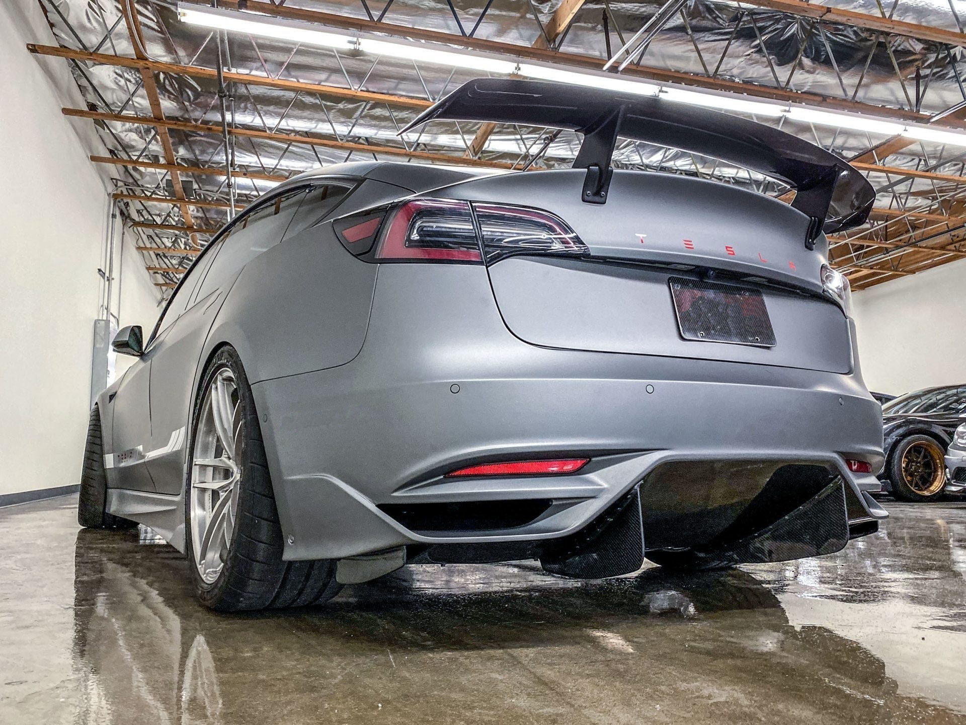 Unplugged Performance Ascension-R Car Conversion Program for Tesla Model 3 carbon fiber