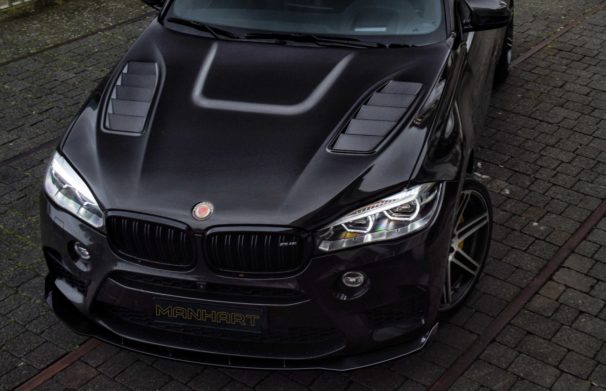 Check our price and buy an Manhart carbon fiber body kit for BMW X6 M F86!